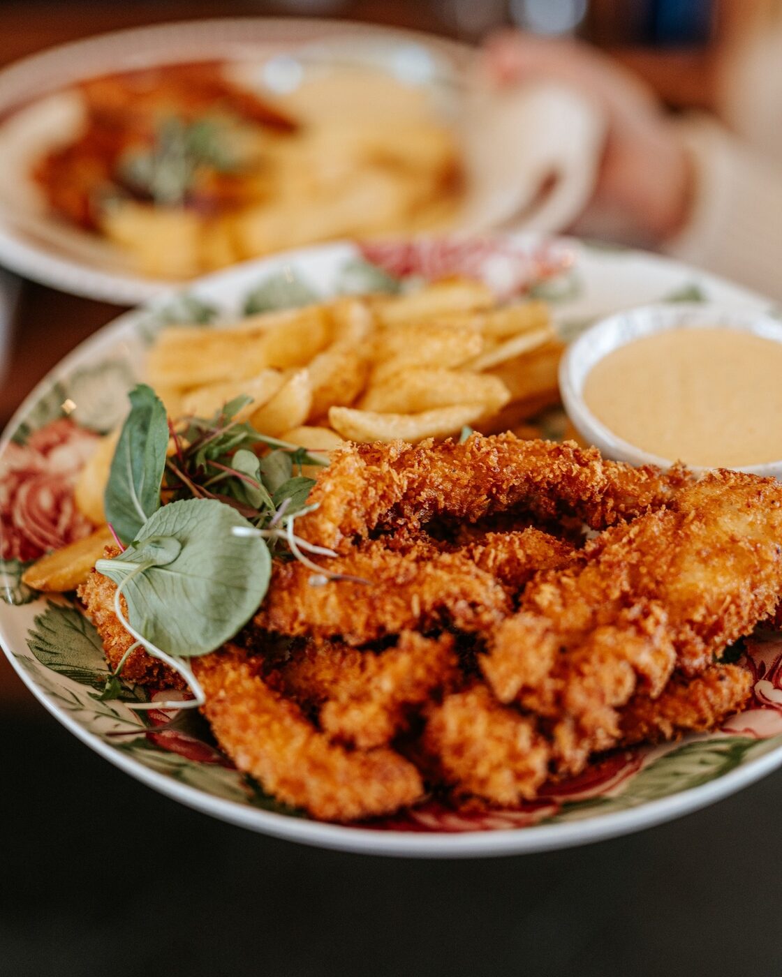 Crumbed chicken strips with hand-cut chips and dipping sauce