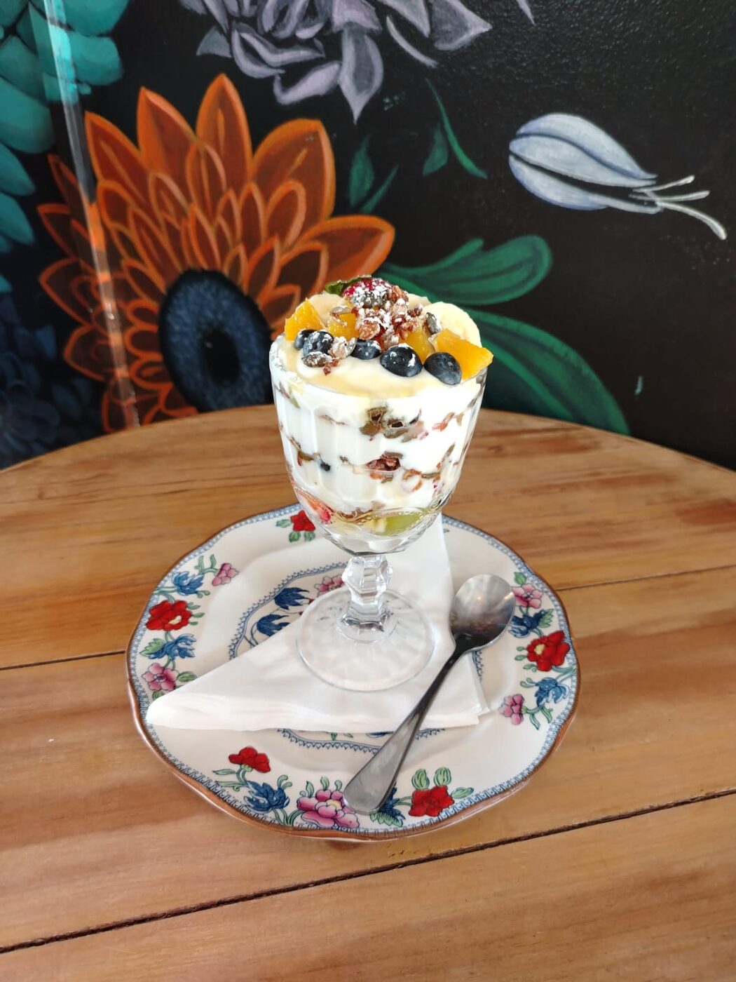 A layered trifle served in a glass